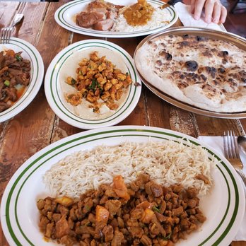 Yemen Café & Restaurant - Far Left - Lamb Livers with onions and tomatoes Middle - Hummus with Chicken Top - Lamb Haneeth Bottom - Lamb Glaba - Middle Eastern Near Me - Brooklyn, New York