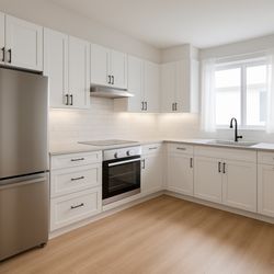 Fast Rehabs - Close-up of the new quartz counters and subway tile backsplash -- sleek, simple, and built to last.