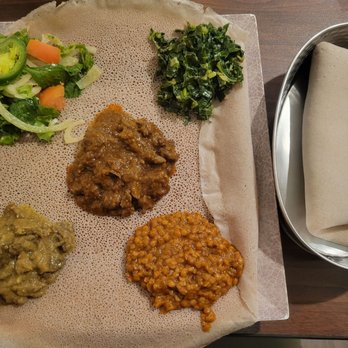 Buna Cafe Philly - Meat combo plate with lentils, salad and greens Meaty Combination Platter - Ethiopian Near Me - Philadelphia, Pennsylvania Buna Cafe Philly - Meat combo plate with lentils, salad and greens Meaty Combination Platter - Ethiopian Near Me - Philadelphia, Pennsylvania