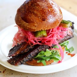 Howard's Meat Co - House Pastrami on a Rye roll with Beet Pickled Saurkraut, Rocket, and Rye IPA Pickles.