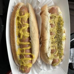 Top Dog - Two natural casing hot dogs.  Left one has yellow mustard and the right one brown mustard and sweet relish.  Great taste and snap.