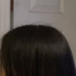 Profiles Hair Studio - That is NOT a straight line on the bottom. That is NOT longer in the front. She didn't take the weight off the back.