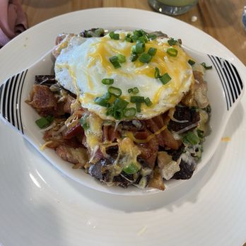 Pink Duck Kitchen - Lechon Kawali & Bacon Loaded Ube Potatoes with egg - Breakfast & Brunch Near Me - Henderson, Nevada Pink Duck Kitchen - Lechon Kawali & Bacon Loaded Ube Potatoes with egg - Breakfast & Brunch Near Me - Henderson, Nevada