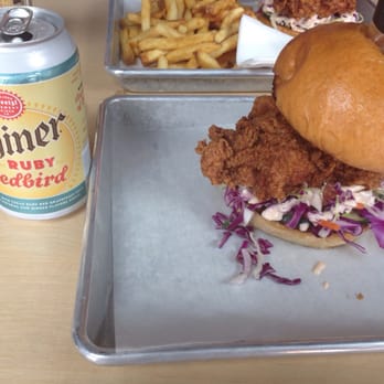 Basilisk - Delicious juicy hot fried chicken sandwich with Shiner beer - New American Near Me - Portland, Oregon