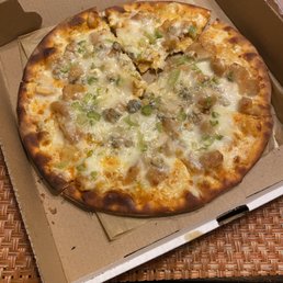 Gross Buffalo chicken pizza with celery.. Gross Buffalo chicken pizza with celery..
