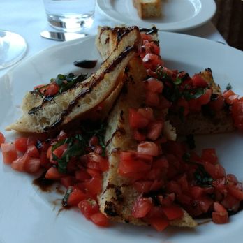 Limoncello - Bruschetta - lightly grilled with finely chopped tomatoes. - Italian Near Me - Greenville, South Carolina Limoncello - Bruschetta - lightly grilled with finely chopped tomatoes. - Italian Near Me - Greenville, South Carolina