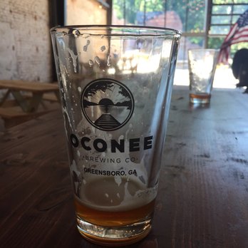 Oconee Brewing - Pint glass and incredible indoor atmosphere - Breweries Near Me - Greensboro, Georgia Oconee Brewing - Pint glass and incredible indoor atmosphere - Breweries Near Me - Greensboro, Georgia