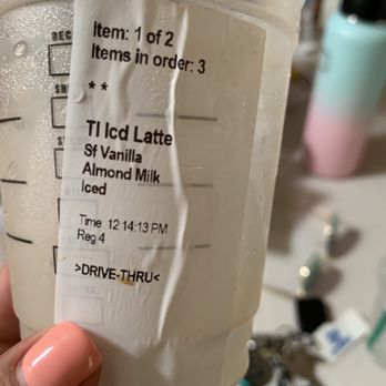 Starbucks - a hand holding a cup of iced latte - Coffee & Tea Near Me - Santa Paula, California Starbucks - a hand holding a cup of iced latte - Coffee & Tea Near Me - Santa Paula, California
