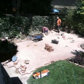 Architectural Pavers and Landscape Company - Pavers being installed - General Contractors Near Me