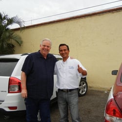 Red Taxi Tours And Transfers - My husband with our wonderful tour guide and taxi driver Jesus.