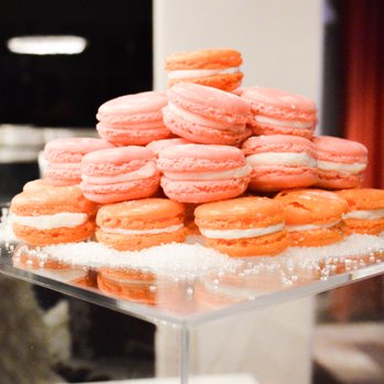 Marcona Kitchen - a stack of orange and white macarons - Caterers Near Me - Arlington, Texas Marcona Kitchen - a stack of orange and white macarons - Caterers Near Me - Arlington, Texas