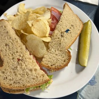 Sweet Temptations - Chicken salad sandwich with pickle and chips - Breakfast & Brunch Near Me - McAllen, Texas Sweet Temptations - Chicken salad sandwich with pickle and chips - Breakfast & Brunch Near Me - McAllen, Texas