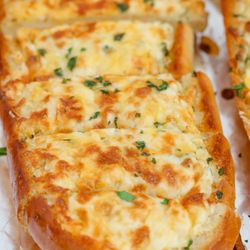 Space City Pizza - Classic Cheesy Bread. Made with 100% real mozzarella and cheddar cheeses, these cheesy delights are perfect for sharing with friends and fam