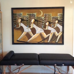 Fantastic framing job on a piece I brought back from the Dominican Republic. The painting is on a bed sheet!