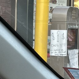 a parking meter with a sign on it