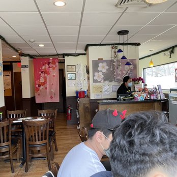 Sakura Japanese Restaurant - a man and a woman sitting at a table - Japanese Near Me - Winchester, Massachusetts Sakura Japanese Restaurant - a man and a woman sitting at a table - Japanese Near Me - Winchester, Massachusetts