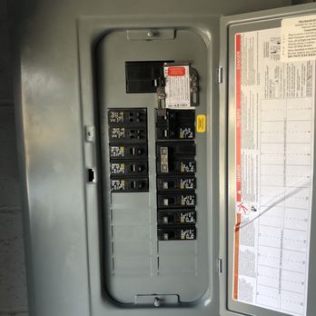 Baran Electric - Inside main panel with interlock kit for generator backup power. (AFTER) - Electricians Near Me
