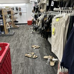 Target - Who is one area towards the back in the men's department where all the shoes are scattered on the floor