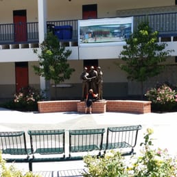 My youngest son looking at a statue on campus. My youngest son looking at a statue on campus.