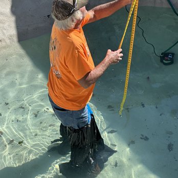 Grays Pool Restoration - Vic working in the pool with makeshift waders. - Pool & Hot Tub Service Near Me - Denham Springs, Louisiana Grays Pool Restoration - Vic working in the pool with makeshift waders. - Pool & Hot Tub Service Near Me - Denham Springs, Louisiana