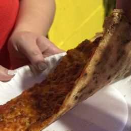 Very thin crust that's well charred Very thin crust that's well charred