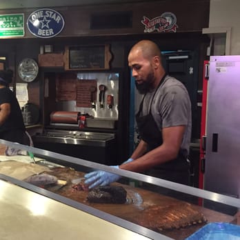 Franklin Barbecue - Hard at work for us at Franklin Barbecue - Barbeque Near Me - Austin, Texas