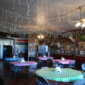The Jersey Lilly - Party room with decades of news, pictures, and more on the walls - American Near Me - Ingomar, Montana