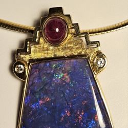 Topaz Goldsmith Repair & Design Studio - Black opal with ruby and diamond