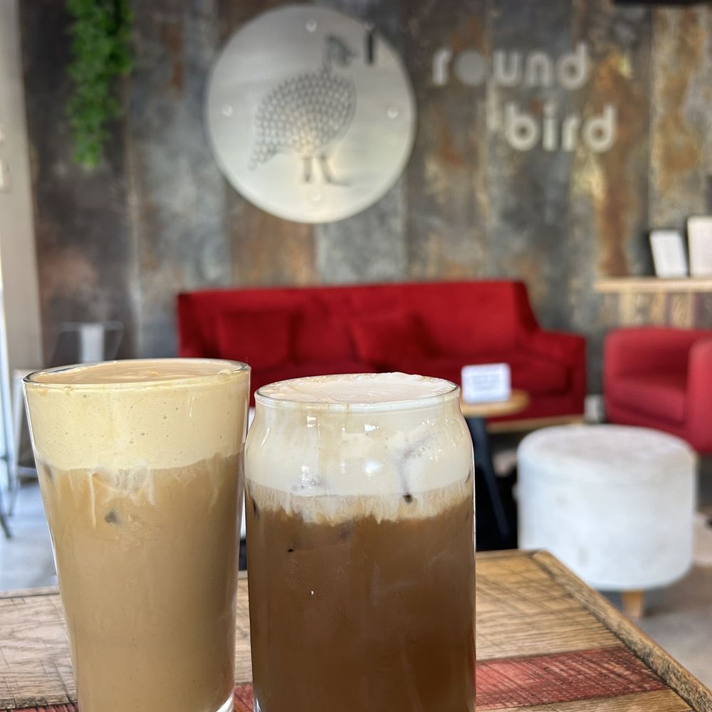Round Bird Coffee - dark chocolate latte with cinnamon cold foam (right), plain latte with whole milk and dark chocolate raspberry latte (left) - Coffee & Tea Near Me - Jacksonville Beach, Florida Round Bird Coffee - dark chocolate latte with cinnamon cold foam (right), plain latte with whole milk and dark chocolate raspberry latte (left) - Coffee & Tea Near Me - Jacksonville Beach, Florida