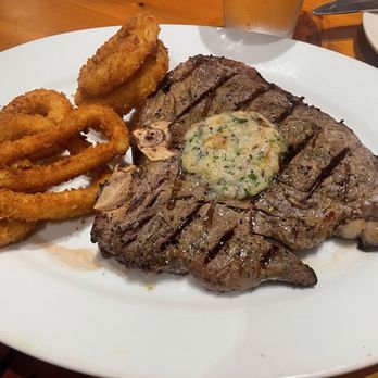 Black Angus Steakhouse - Porterhouse steak sans marbling, onion rings - Steakhouses Near Me - San Jose, California Black Angus Steakhouse - Porterhouse steak sans marbling, onion rings - Steakhouses Near Me - San Jose, California