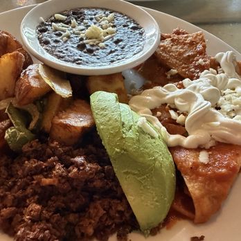Savoie Italian Eatery - "The Special"- Chilaquiles, Soy Chorizo, beans, potatoes, Avocado, sour cream, and eggs. - Italian Near Me - Chula Vista, California Savoie Italian Eatery - "The Special"- Chilaquiles, Soy Chorizo, beans, potatoes, Avocado, sour cream, and eggs. - Italian Near Me - Chula Vista, California