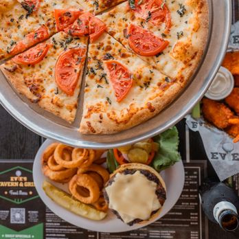 Evie's Tavern On The Range - a pizza and onion rings - Sports Bars Near Me - Sarasota, Florida Evie's Tavern On The Range - a pizza and onion rings - Sports Bars Near Me - Sarasota, Florida