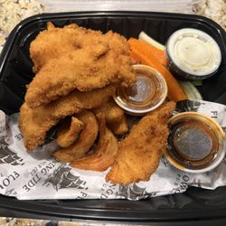 Chicken Tenders with fries and sauces on the side. These are amazing and well worth the price.