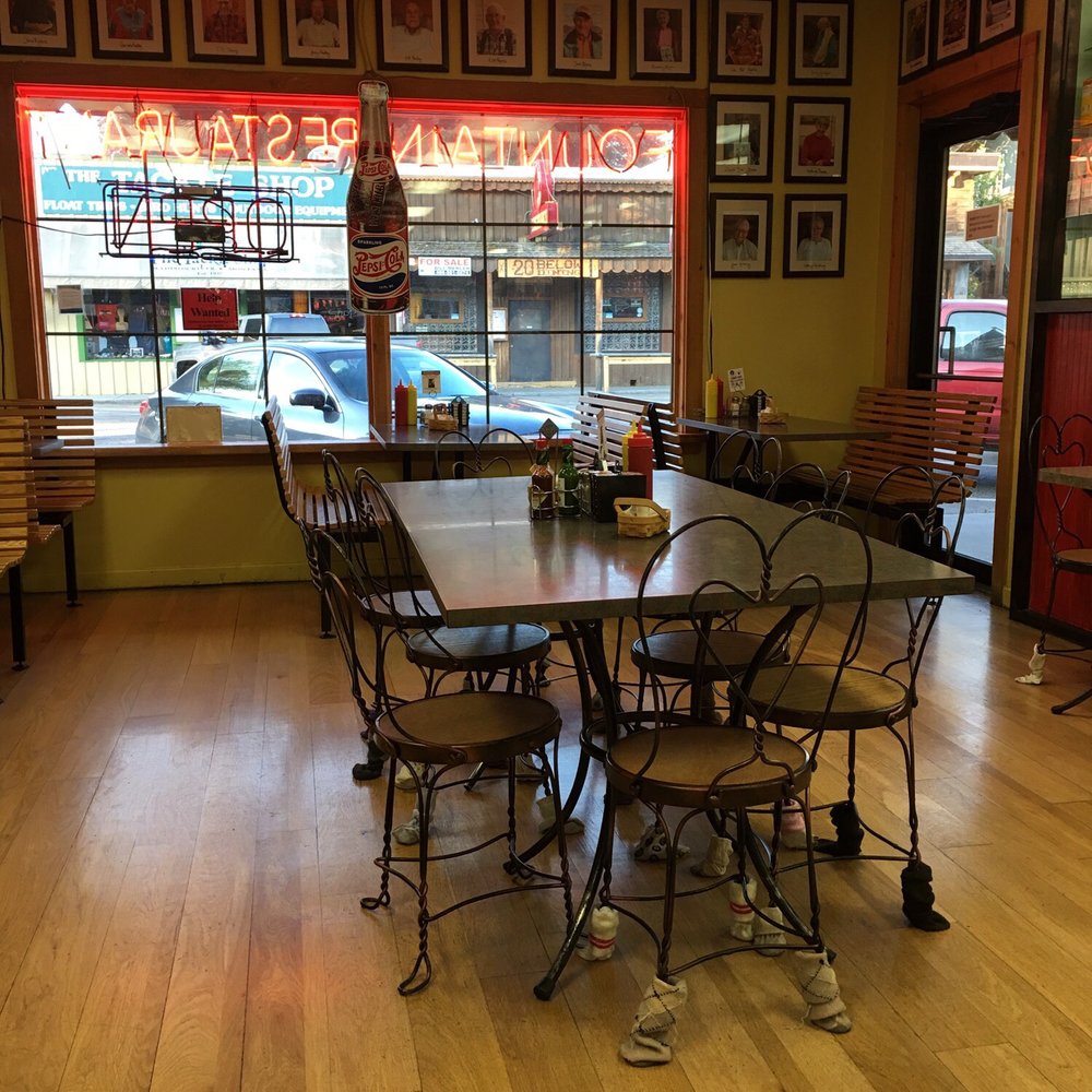 a table and chairs in a restaurant a table and chairs in a restaurant