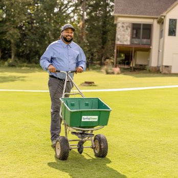 SpringGreen - a man pushing a lawn cart - Tree Services Near Me - Charlotte, North Carolina SpringGreen - a man pushing a lawn cart - Tree Services Near Me - Charlotte, North Carolina