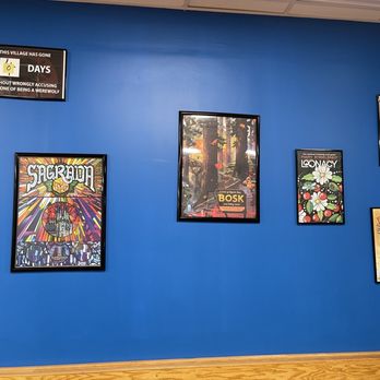Bonus Round Game Cafe - a blue wall with posters on it - Cafes Near Me - Chicago, Illinois