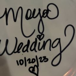 They gave the wedding couple a plate to draw on so that it could be displayed in the restaurant.