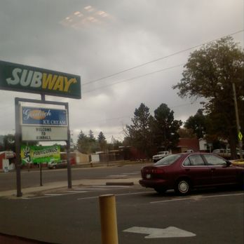 Subway - a red car passing by a subway sign - Fast Food Near Me - Kimball, Nebraska Subway - a red car passing by a subway sign - Fast Food Near Me - Kimball, Nebraska