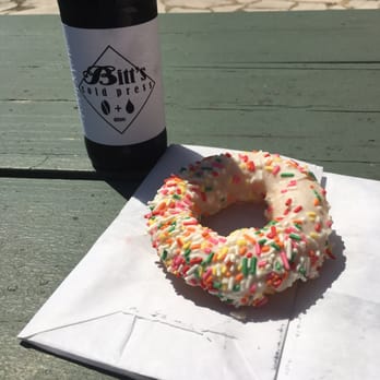 Strange Donuts - Rainbow pony donut and a cold bitt's - Donuts Near Me - Maplewood, Missouri