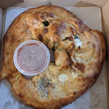 Mellow Mushroom Birmingham - Calzone with fresh basil, spinach, and Roma tomatoes (comes with a large side cup of tomato sauce for dipping) - Pizza Near Me - Birmingham, Alabama Mellow Mushroom Birmingham - Calzone with fresh basil, spinach, and Roma tomatoes (comes with a large side cup of tomato sauce for dipping) - Pizza Near Me - Birmingham, Alabama