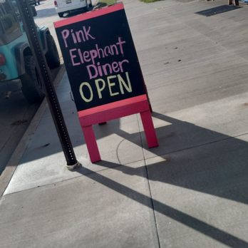 Pink Elephant Diner - a pink elephant sign on the sidewalk - American Near Me - Hart, Michigan Pink Elephant Diner - a pink elephant sign on the sidewalk - American Near Me - Hart, Michigan
