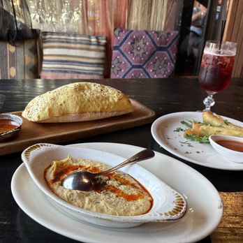 Talullas - Hummus with roasted red pepper sauce and fresh baked bread! Flash fried phyllo dough filled with Turkish feta and herbs. - Middle Eastern Near Me - Chapel Hill, North Carolina Talullas - Hummus with roasted red pepper sauce and fresh baked bread! Flash fried phyllo dough filled with Turkish feta and herbs. - Middle Eastern Near Me - Chapel Hill, North Carolina