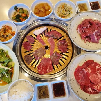 Han Yang Restaurant - The spread of food. The meats are beef tongue and garlic kobe beef. - Korean Near Me - Honolulu, Hawaii