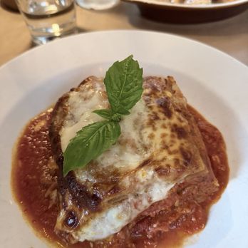 Go Nonna - Lasagna with bechamel and bolognese. Behind the lasagna is shrimp. - Argentine Near Me - Long Island City, New York