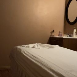 Melody Massage and Waxing - Massage bed with clean sheets