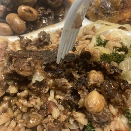 Vegan oxtail (Mocktail) with rice and peas, kale and cabbage, and plantains Vegan oxtail (Mocktail) with rice and peas, kale and cabbage, and plantains