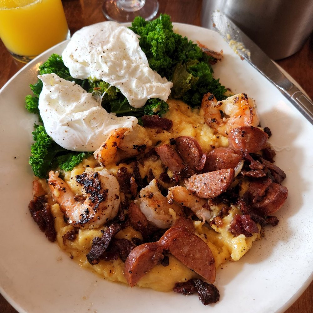 Poach 503 - Shrimp and cheesy grits. With sautéed kale and poached eggs. - Breakfast & Brunch Near Me - Manzanita, Oregon Poach 503 - Shrimp and cheesy grits. With sautéed kale and poached eggs. - Breakfast & Brunch Near Me - Manzanita, Oregon
