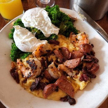Poach 503 - Shrimp and cheesy grits.  With sautéed kale and poached eggs. - Breakfast & Brunch Near Me - Manzanita, Oregon
