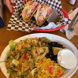 Tacorita - Shrimp tacos Shredded chicken burrito bowl with sautéed peppers and onions, sour cream, & corn salsa.