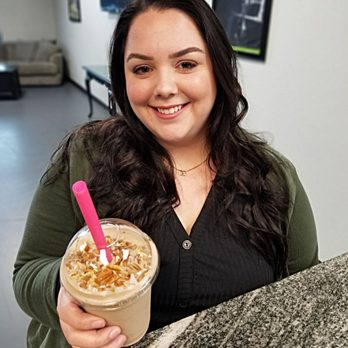 Tru Nutrition - a woman holding a cup of coffee - Juice Bars & Smoothies Near Me - Edmond, Oklahoma Tru Nutrition - a woman holding a cup of coffee - Juice Bars & Smoothies Near Me - Edmond, Oklahoma